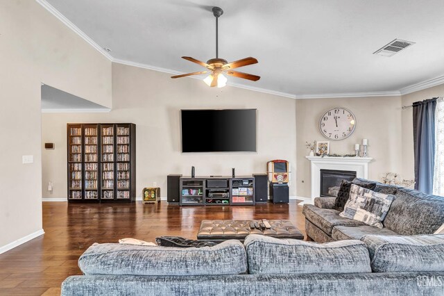 12503 Maclure Dr, Bakersfield, CA 93311 - living area with wood finished floors, ceiling fan, ornamental molding, and a glass covered fireplace