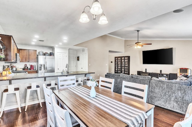 12503 Maclure Dr, Bakersfield, CA 93311 - dining room with ornamental molding, dark wood-type flooring, ceiling fan, lofted ceiling, and a chandelier