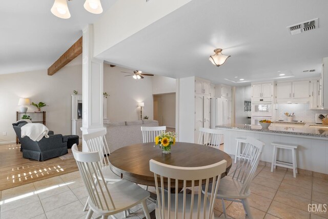 2700 Hoad Ln, Bakersfield, CA 93309 - dining space with light tile patterned floors, a ceiling fan, beamed ceiling, ornate columns, and recessed lighting