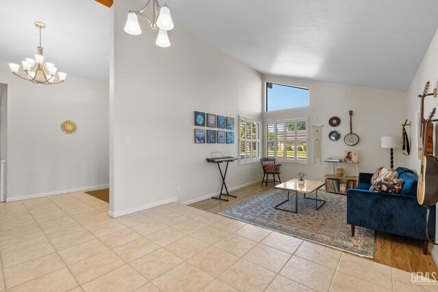 2700 Hoad Ln, Bakersfield, CA 93309 - tiled living room featuring a chandelier, high vaulted ceiling, and baseboards