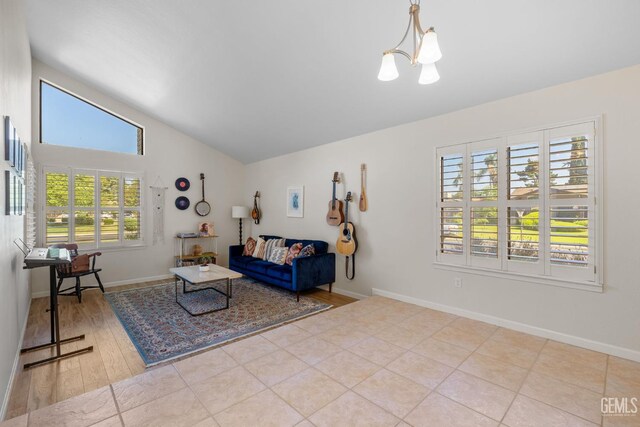 2700 Hoad Ln, Bakersfield, CA 93309 - living area featuring vaulted ceiling, a chandelier, baseboards, and wood finished floors