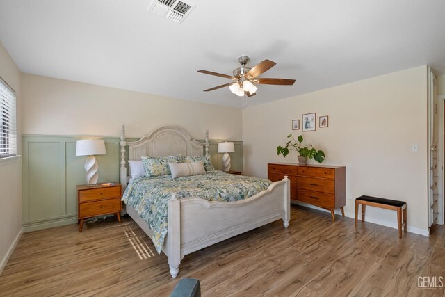 2700 Hoad Ln, Bakersfield, CA 93309 - bedroom with light wood-type flooring, a ceiling fan, and baseboards
