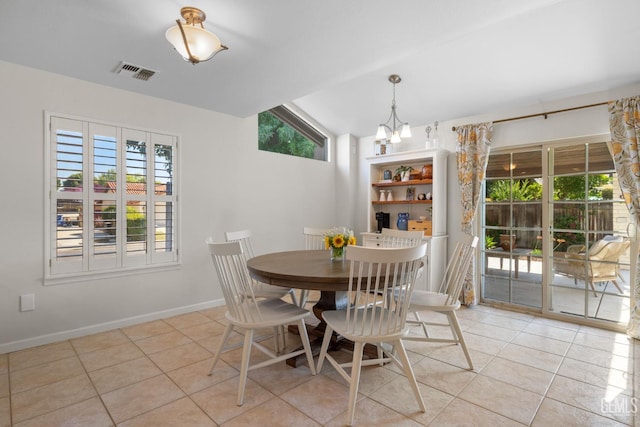 2700 Hoad Ln, Bakersfield, CA 93309 - dining area with a chandelier, light tile patterned floors, and baseboards