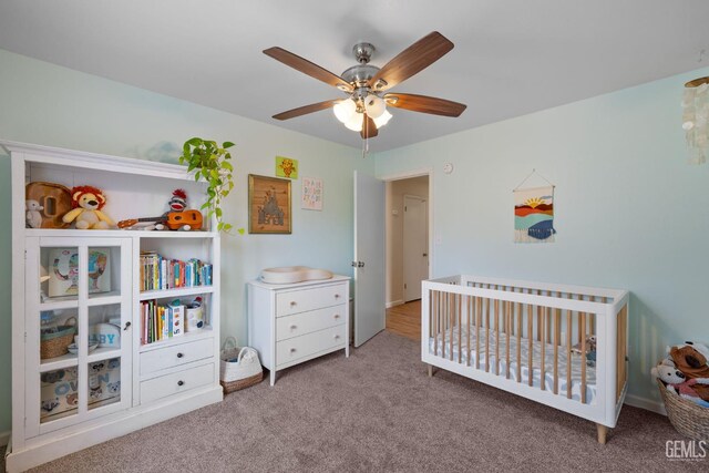 2700 Hoad Ln, Bakersfield, CA 93309 - carpeted bedroom featuring a crib and ceiling fan