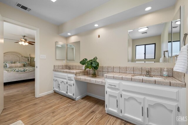 2700 Hoad Ln, Bakersfield, CA 93309 - bathroom with ensuite bath, wood finished floors, vanity, a ceiling fan, and recessed lighting