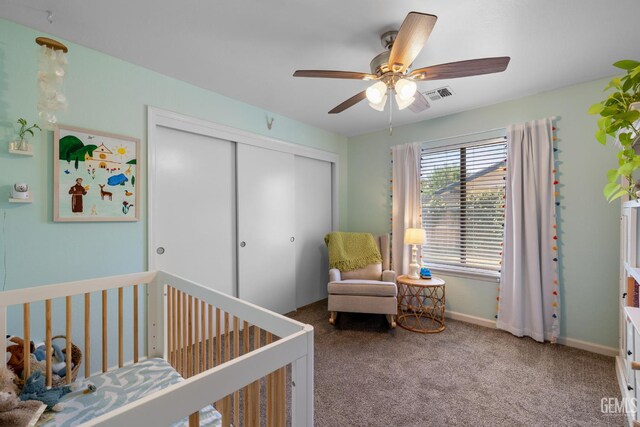 2700 Hoad Ln, Bakersfield, CA 93309 - bedroom with a closet, a crib, carpet flooring, a ceiling fan, and baseboards