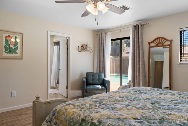 2700 Hoad Ln, Bakersfield, CA 93309 - bedroom featuring access to outside, wood finished floors, baseboards, and ceiling fan