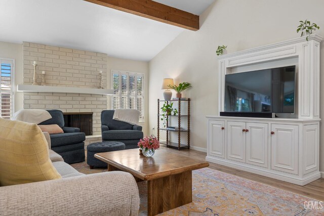 2700 Hoad Ln, Bakersfield, CA 93309 - living room with light wood-type flooring, baseboards, and a fireplace