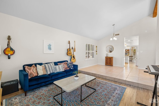 2700 Hoad Ln, Bakersfield, CA 93309 - living room featuring baseboards, wood finished floors, and high vaulted ceiling