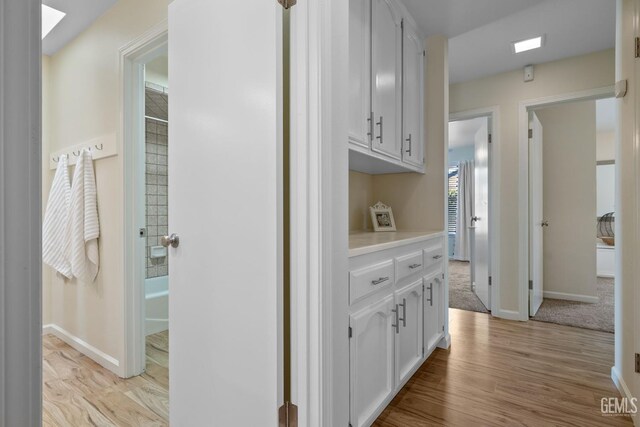 2700 Hoad Ln, Bakersfield, CA 93309 - corridor with light wood-type flooring and baseboards