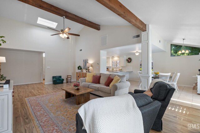 2700 Hoad Ln, Bakersfield, CA 93309 - living room with light wood-style floors, beamed ceiling, high vaulted ceiling, ceiling fan, and baseboards