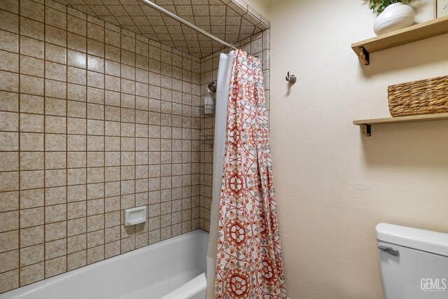 2700 Hoad Ln, Bakersfield, CA 93309 - bathroom featuring shower / bathtub combination with curtain and toilet
