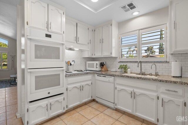 2700 Hoad Ln, Bakersfield, CA 93309 - kitchen featuring white appliances, a sink, white cabinets, and decorative backsplash