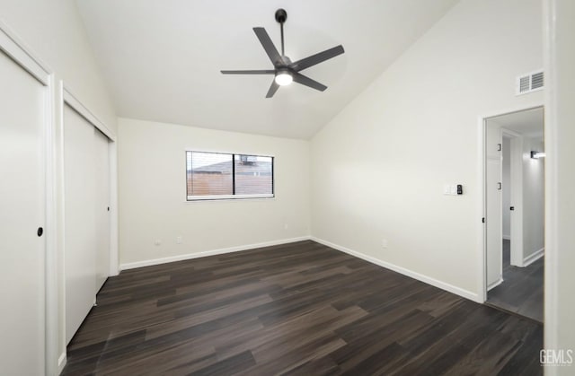 unfurnished bedroom featuring high vaulted ceiling, visible vents, baseboards, and dark wood-type flooring