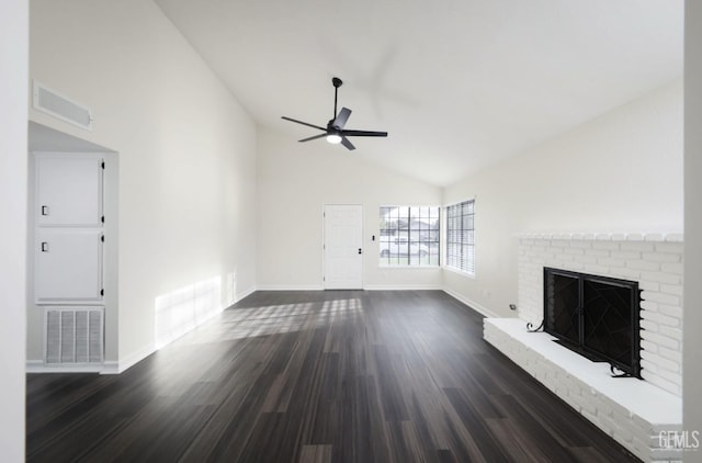 unfurnished living room featuring a ceiling fan, a brick fireplace, visible vents, and dark wood-style flooring