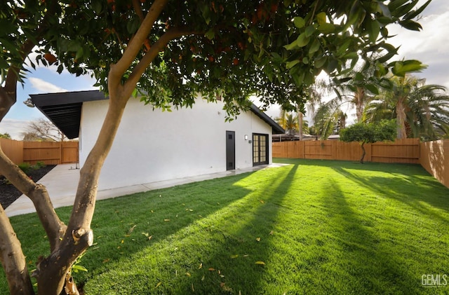 view of yard with a fenced backyard