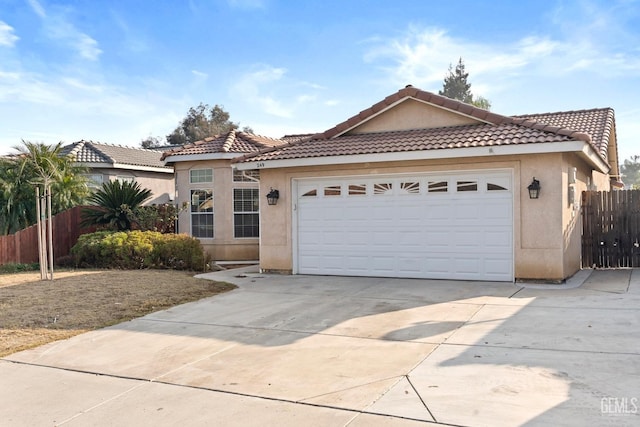 mediterranean / spanish house featuring a garage