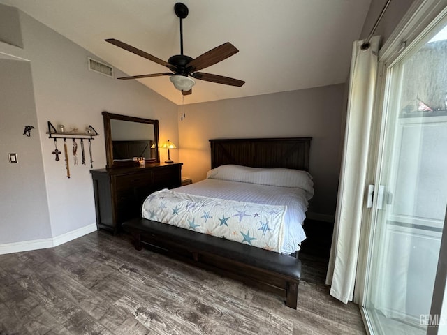 bedroom featuring ceiling fan, dark hardwood / wood-style flooring, and lofted ceiling