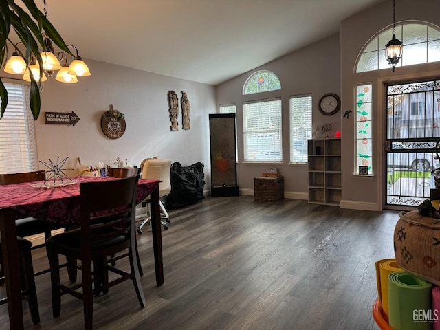 dining room with dark hardwood / wood-style flooring and vaulted ceiling