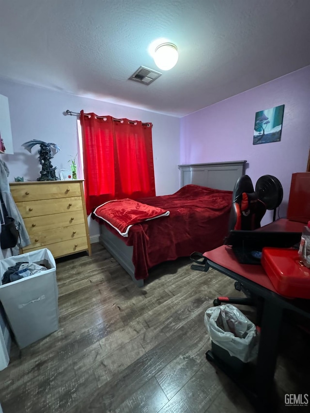 bedroom featuring wood-type flooring