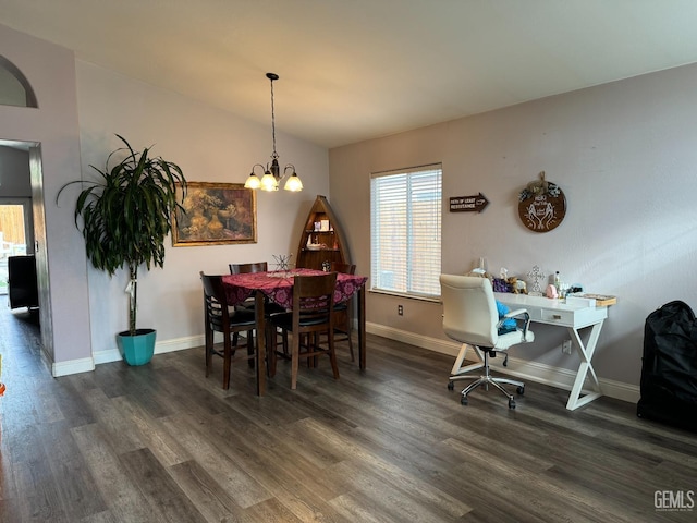 dining space with vaulted ceiling, dark hardwood / wood-style floors, and a notable chandelier