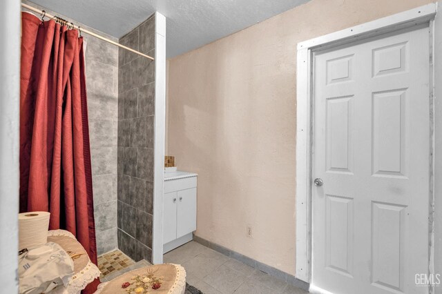 1504 Stockton Ave, Bakersfield, CA 93308 - full bathroom with tiled shower and tile patterned flooring