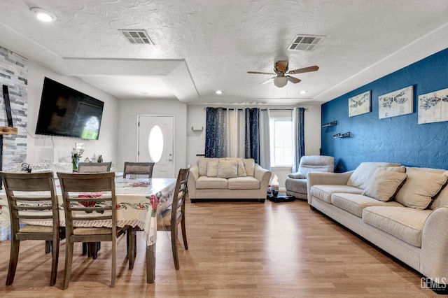 1504 Stockton Ave, Bakersfield, CA 93308 - dining area featuring ceiling fan, a textured ceiling, and light wood-type flooring