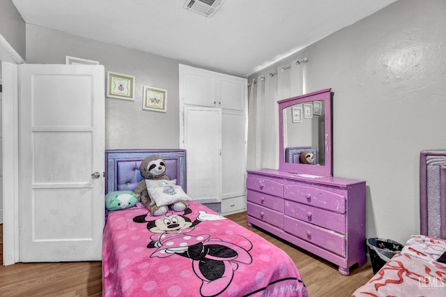 1504 Stockton Ave, Bakersfield, CA 93308 - bedroom featuring wood finished floors and a textured wall