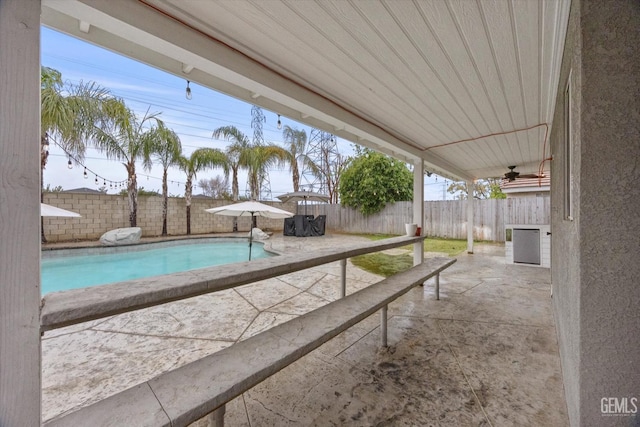 view of swimming pool featuring a patio, a fenced backyard, and a fenced in pool