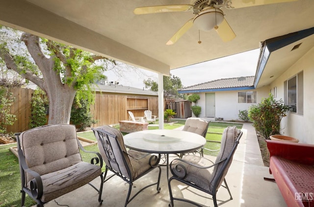 view of patio / terrace featuring outdoor dining space, a fenced backyard, and ceiling fan