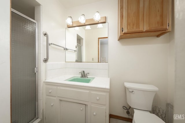 full bathroom with backsplash, toilet, a shower stall, and vanity