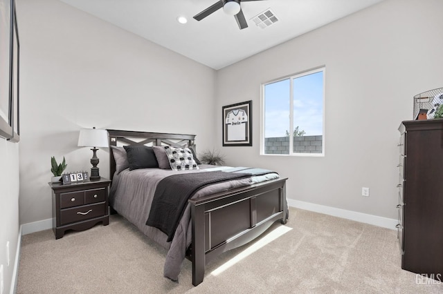 bedroom featuring ceiling fan and light carpet