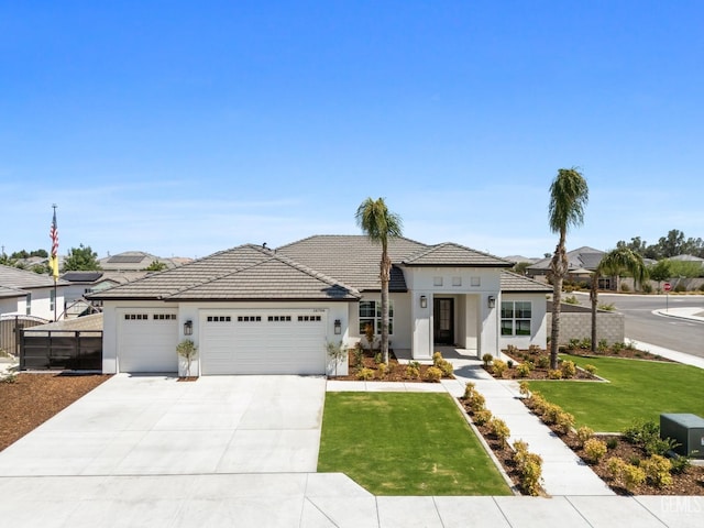 view of front facade with a garage and a front yard