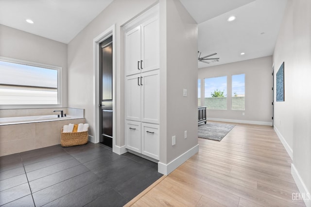 corridor featuring light hardwood / wood-style floors