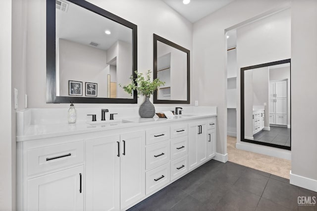 bathroom featuring tile patterned floors and vanity