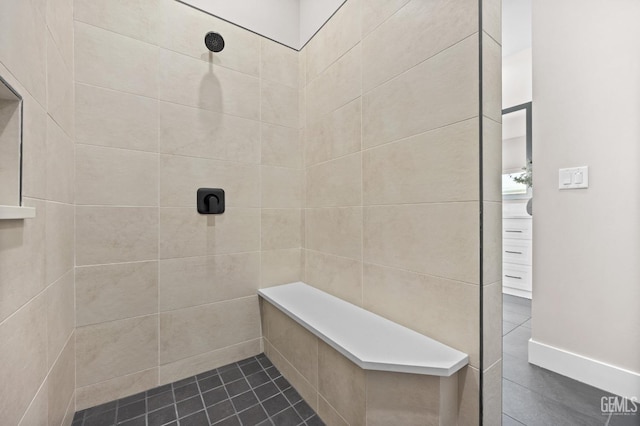 bathroom featuring tiled shower