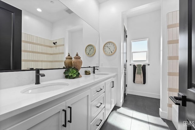 bathroom with tile patterned flooring and vanity