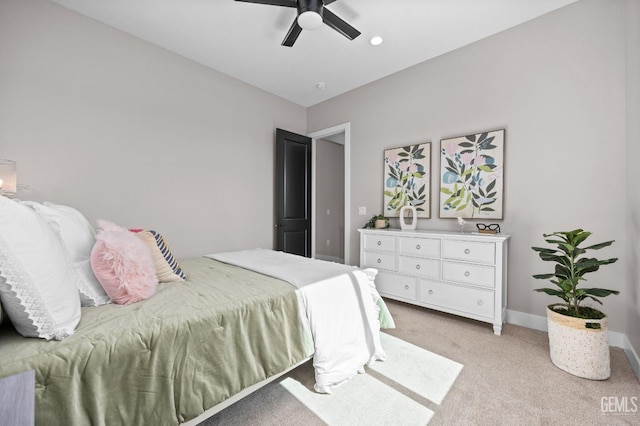 bedroom with ceiling fan and light colored carpet