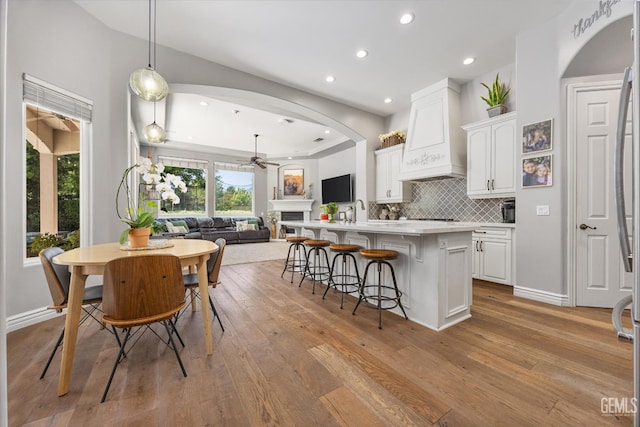 1001 Paxton Way, Bakersfield, CA 93312 - kitchen featuring ceiling fan, open floor plan, white cabinetry, light wood finished floors, and recessed lighting