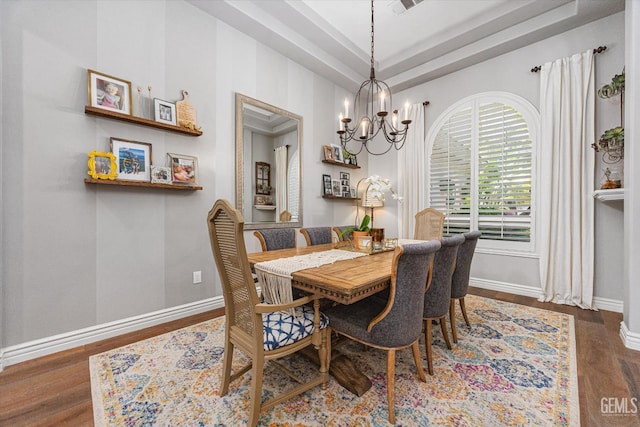 1001 Paxton Way, Bakersfield, CA 93312 - dining area featuring a chandelier, wood finished floors, and a raised ceiling