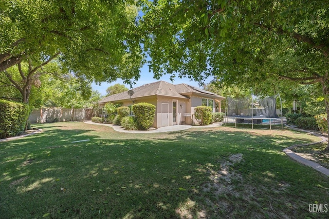 1001 Paxton Way, Bakersfield, CA 93312 - fenced backyard featuring a trampoline