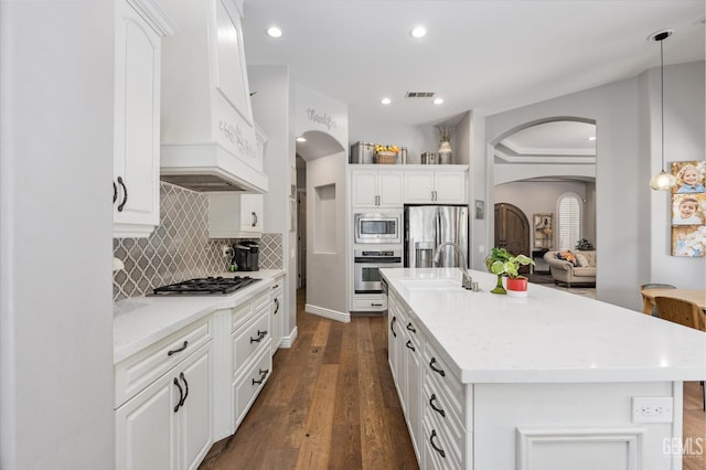 1001 Paxton Way, Bakersfield, CA 93312 - kitchen featuring arched walkways, appliances with stainless steel finishes, white cabinetry, and recessed lighting