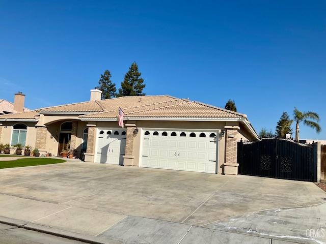 single story home featuring a tile roof, a chimney, a gate, a garage, and driveway