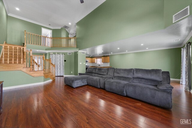 4312 Rio Viejo Dr, Bakersfield, CA 93313 - living area featuring visible vents, a towering ceiling, and ornamental molding