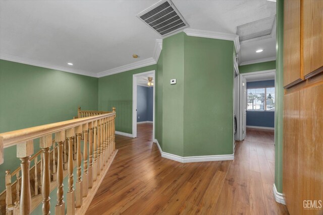 4312 Rio Viejo Dr, Bakersfield, CA 93313 - hall featuring visible vents, ornamental molding, an upstairs landing, baseboards, and hardwood / wood-style flooring