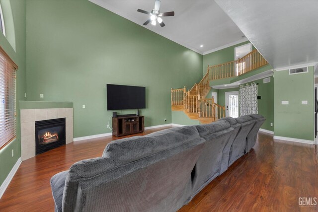 4312 Rio Viejo Dr, Bakersfield, CA 93313 - living area featuring high vaulted ceiling, baseboards, visible vents, and stairway