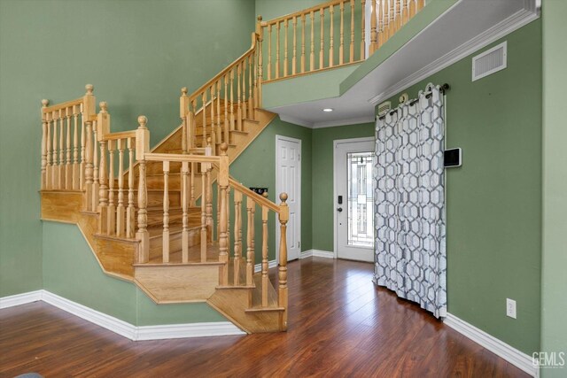 4312 Rio Viejo Dr, Bakersfield, CA 93313 - stairway featuring baseboards, crown molding, wood finished floors, and visible vents