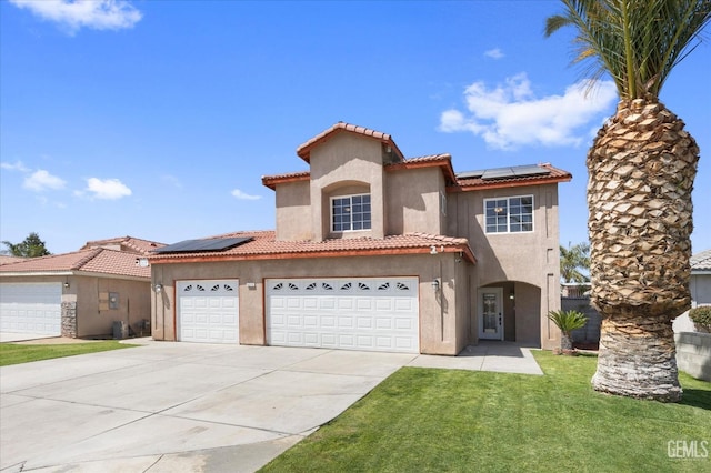 4312 Rio Viejo Dr, Bakersfield, CA 93313 - mediterranean / spanish-style home featuring stucco siding, roof mounted solar panels, driveway, and a tile roof