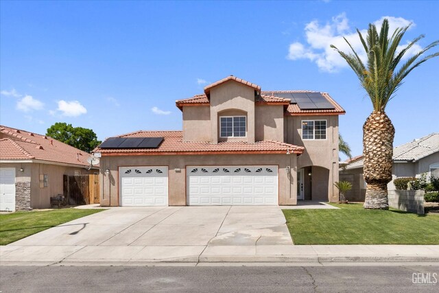 4312 Rio Viejo Dr, Bakersfield, CA 93313 - mediterranean / spanish-style home with stucco siding, solar panels, driveway, and a front yard
