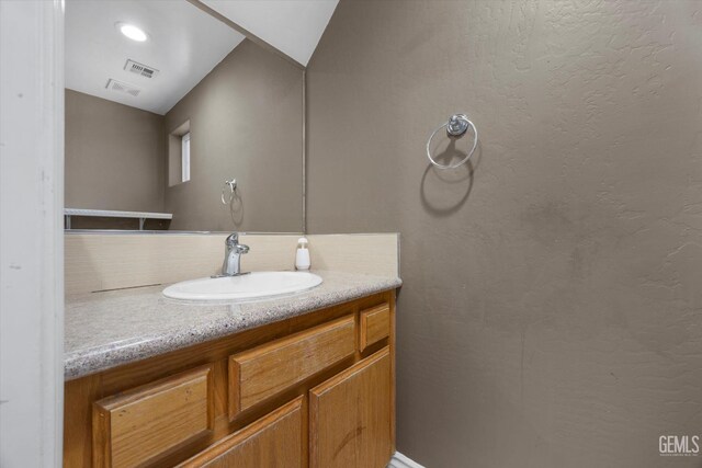 4312 Rio Viejo Dr, Bakersfield, CA 93313 - bathroom featuring visible vents, vanity, and tasteful backsplash